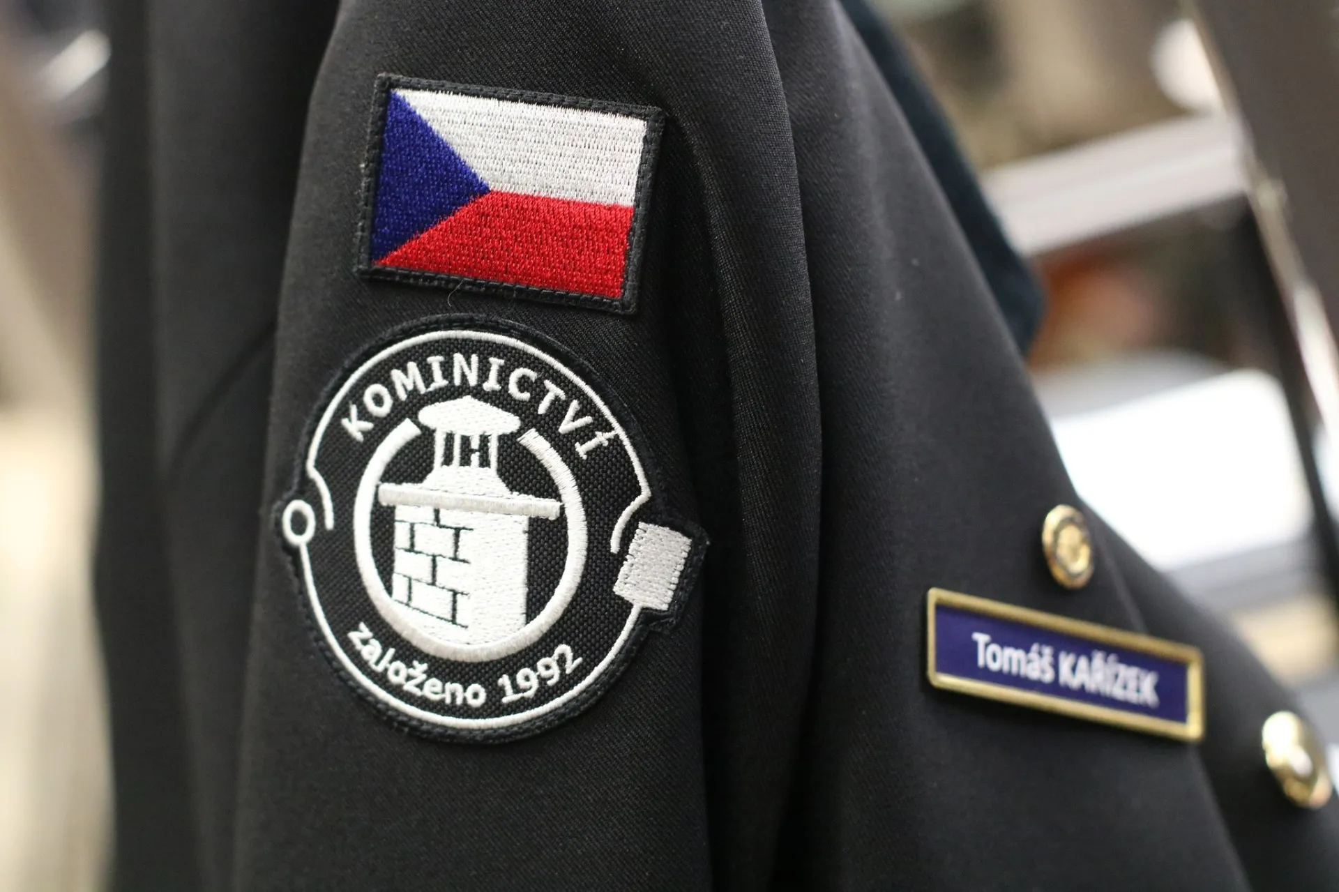 Odznak Kominictví Hlavín na kominické uniformě
